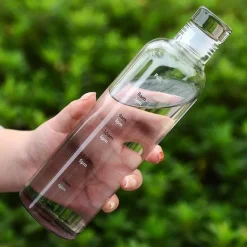 Hitzebeständige Glaswasserflasche - Stilvolles Zeitskalen-Design