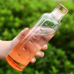 Hitzebeständige Glaswasserflasche - Stilvolles Zeitskalen-Design
