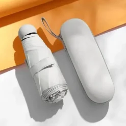 Kompakter Mini-Regenschirm für tragbaren Regen- und Sonnenschutz