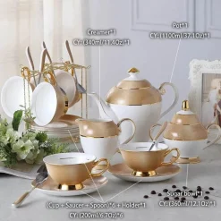 Luxuriöses Teeservice aus Knochenporzellan mit Goldbesatz, Teekanne, Kaffeetassen und Milchkännchen