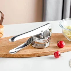 Obst- und Gemüsestampfer aus Edelstahl – Saftpresse