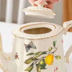 Tee- und Kaffeeservice aus Keramik – Zitronenteekanne mit goldenem Rand und Untertasse