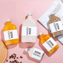 Wiederverwendbare Getränkeflaschen aus klarem Glas – perfekt zum Entsaften von Smoothies, Kombucha, Tee, Milch und Wein